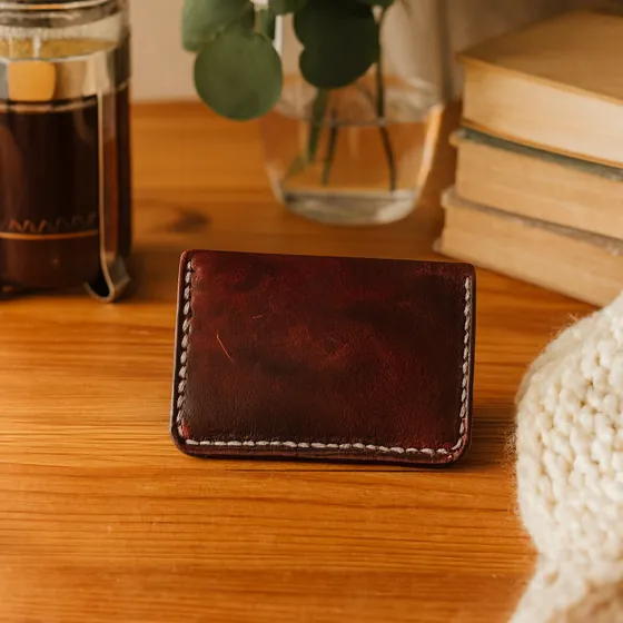 Leather card holder: photo generated by ListifyAI (styled desk scene)